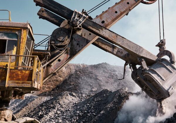 Quarry bucket excavator works in a slag dump Huge quarry bucket excavator works in a hot outdoors slag dump. Heavy industrial metallurgical foggy landscape
